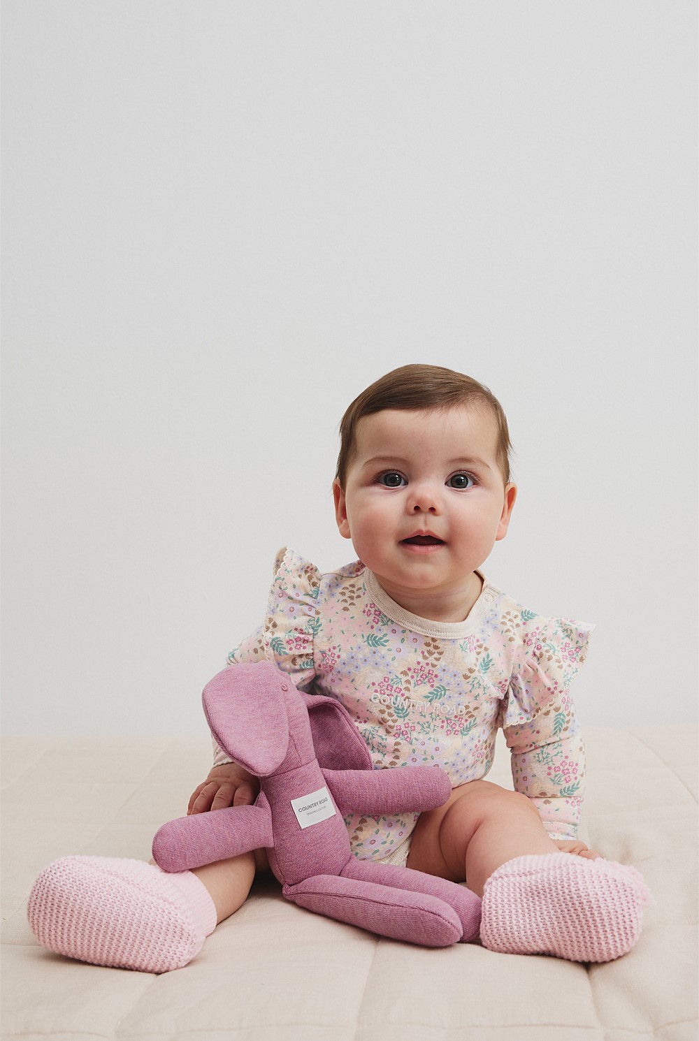 Organically Grown Cotton Blend Frill Long Sleeve Logo Bodysuit