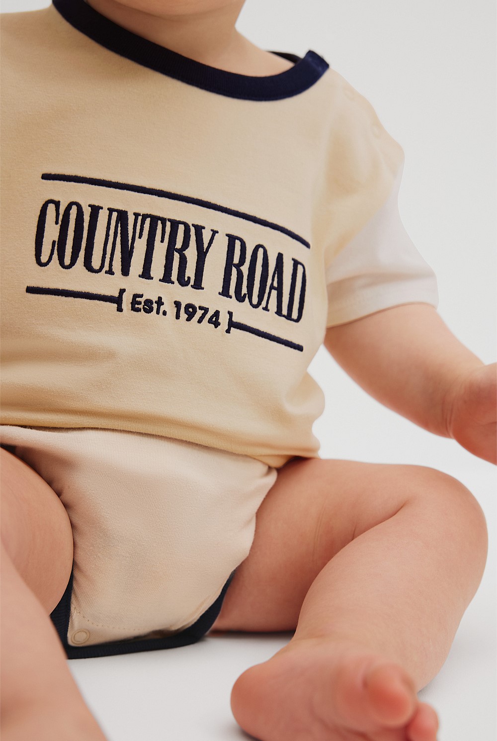 Organically Grown Cotton Spliced Logo Short Sleeve Bodysuit